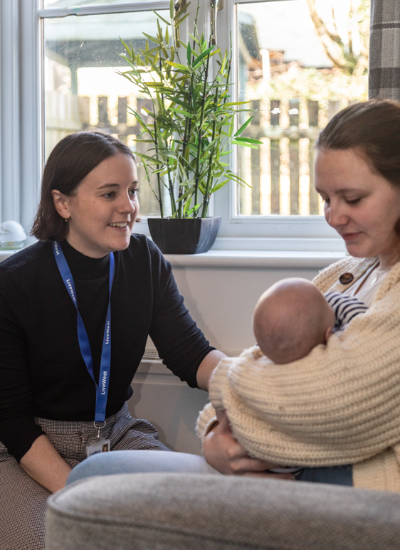 Woman and baby with colleague