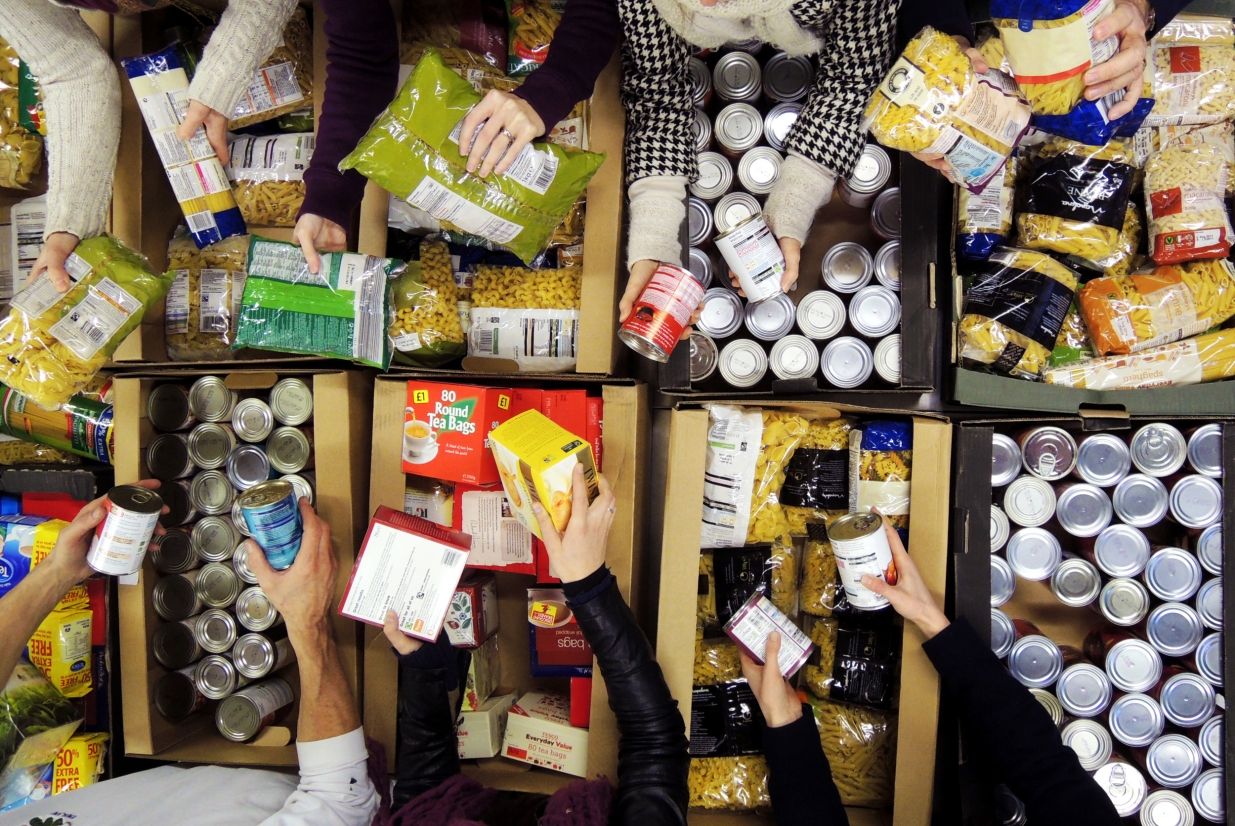 An image of people collecting food at a food bank.