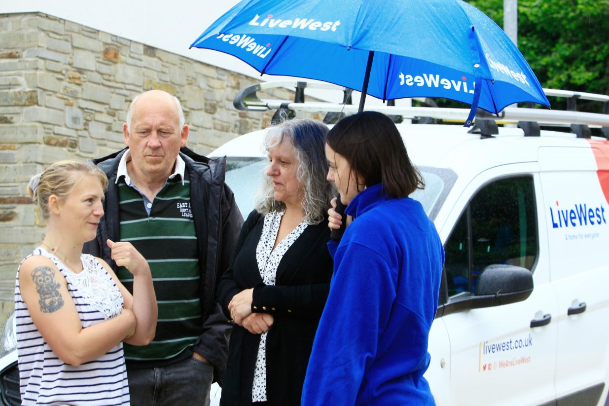 Three residents talking to a LiveWest colleague.