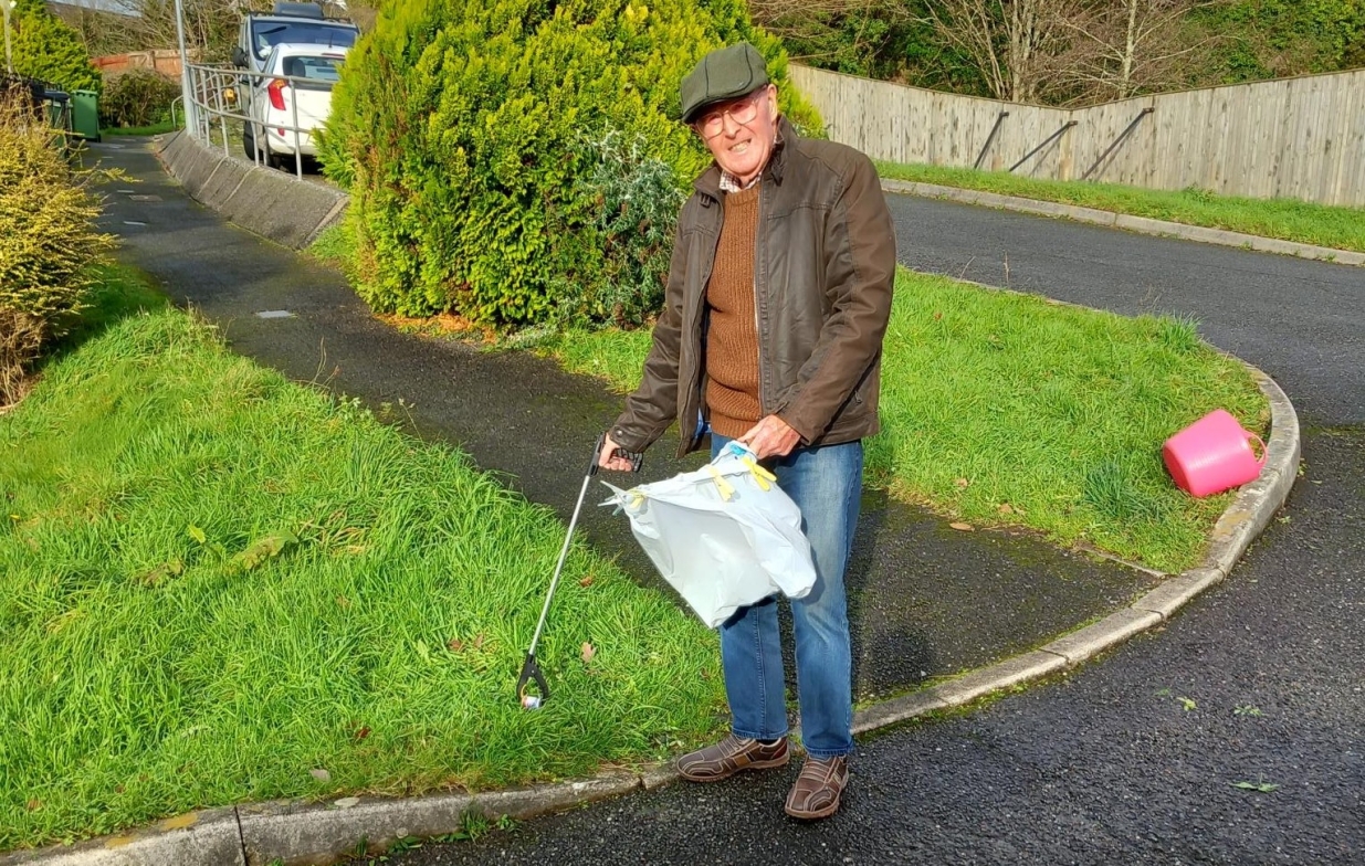 William litter picking in his community.