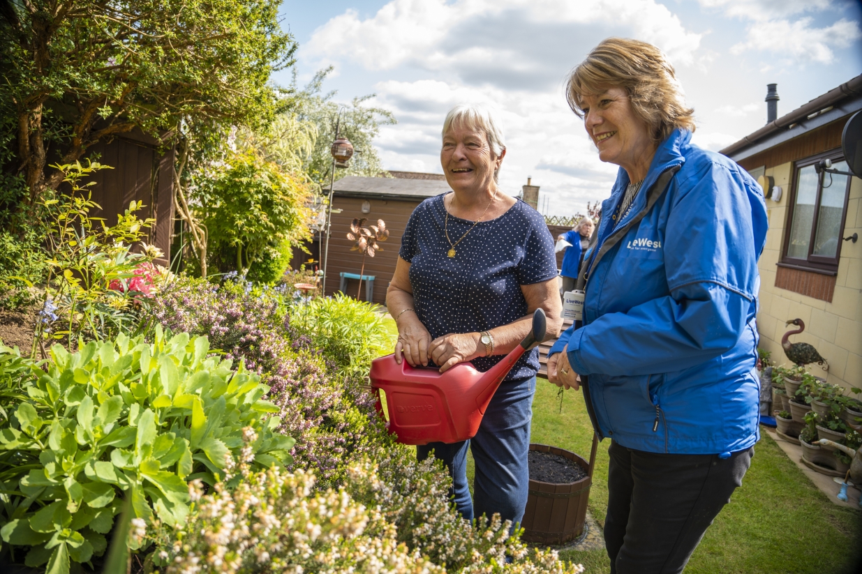 LiveWest colleague and customer in the garden