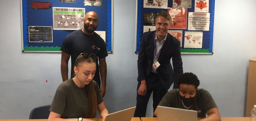 Teacher Jake Mensah and Dan Carter Headteacher at Learning Partnership West School with students and their new laptops LiveWest.