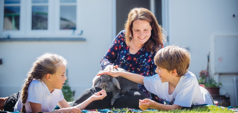 A woman with two children. 