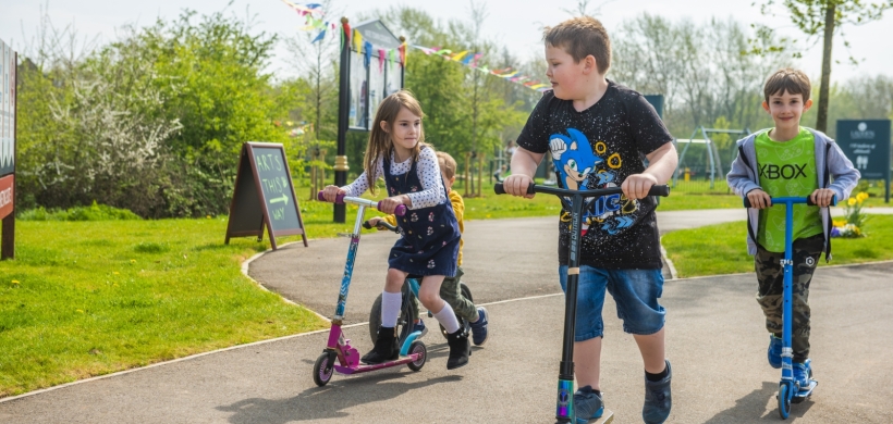 children on scooters