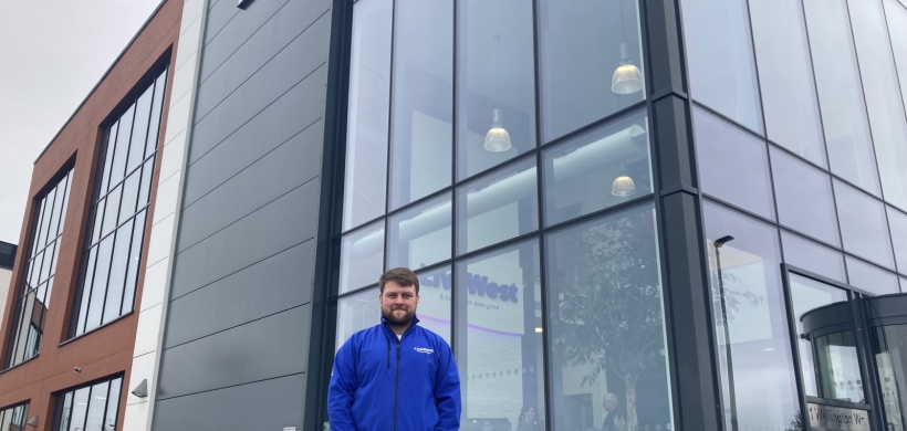 Ben Logan smiling outside of our Exeter office.
