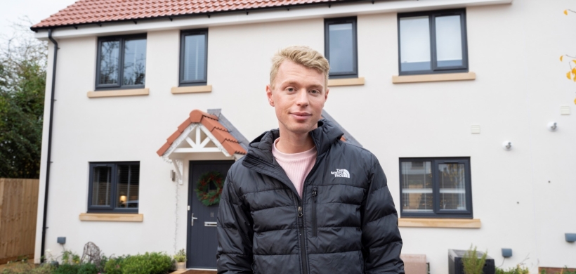 First-time buyer, Jack Benjamin outside his new energy-efficient home.