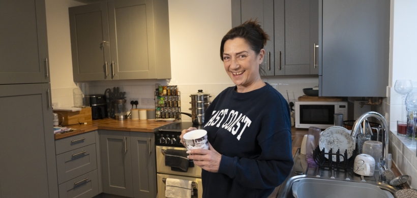 Mary in her kitchen in the new build home in Congresbury.