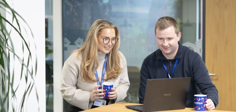 Colleagues working on a laptop