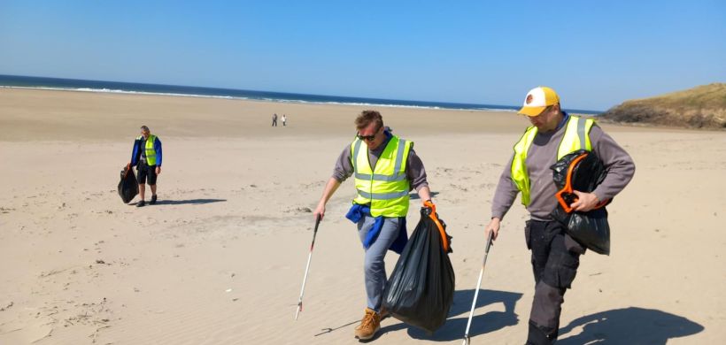 LiveWest colleagues litter picking on a beach.