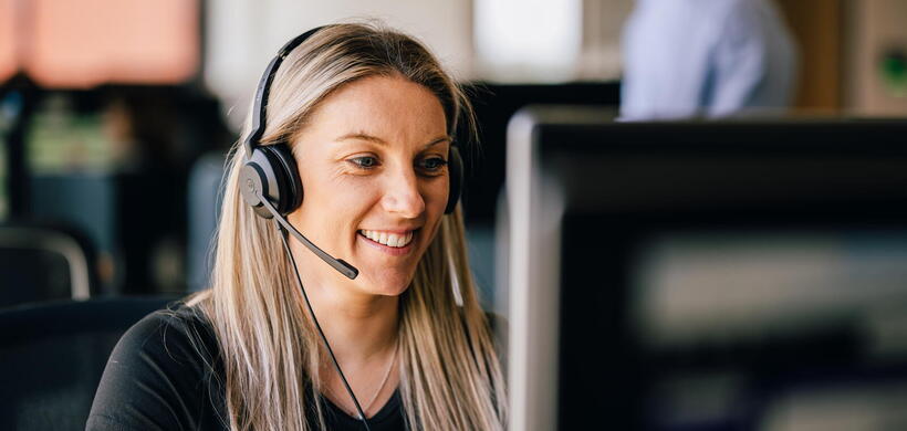 Colleague with headset on, speaking on the phone