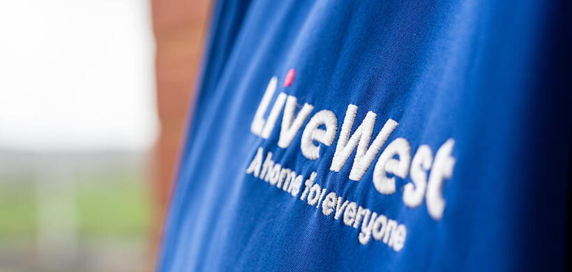 Image of a LiveWest logo on a blue jacket.