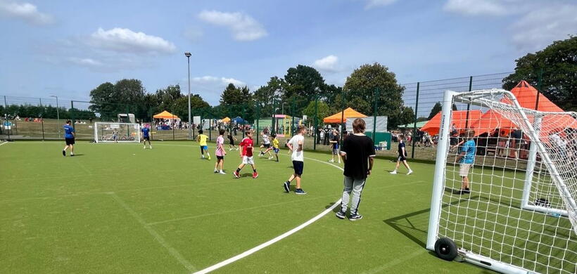 A group of young people playing football as part in our free activity sessions. 