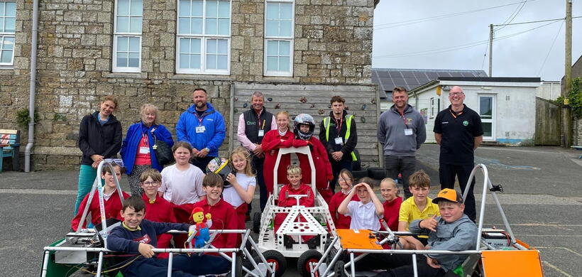 Pupils, teachers and contractors with the Greenpower Goblin car built by the pupils.