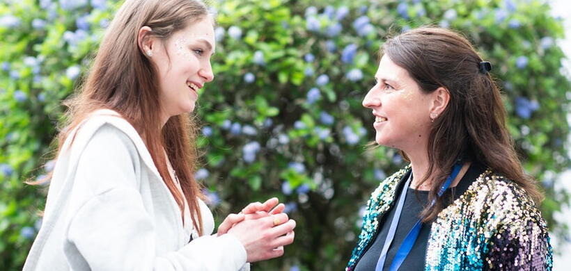 Saskia chatting to a colleague at the foyer.