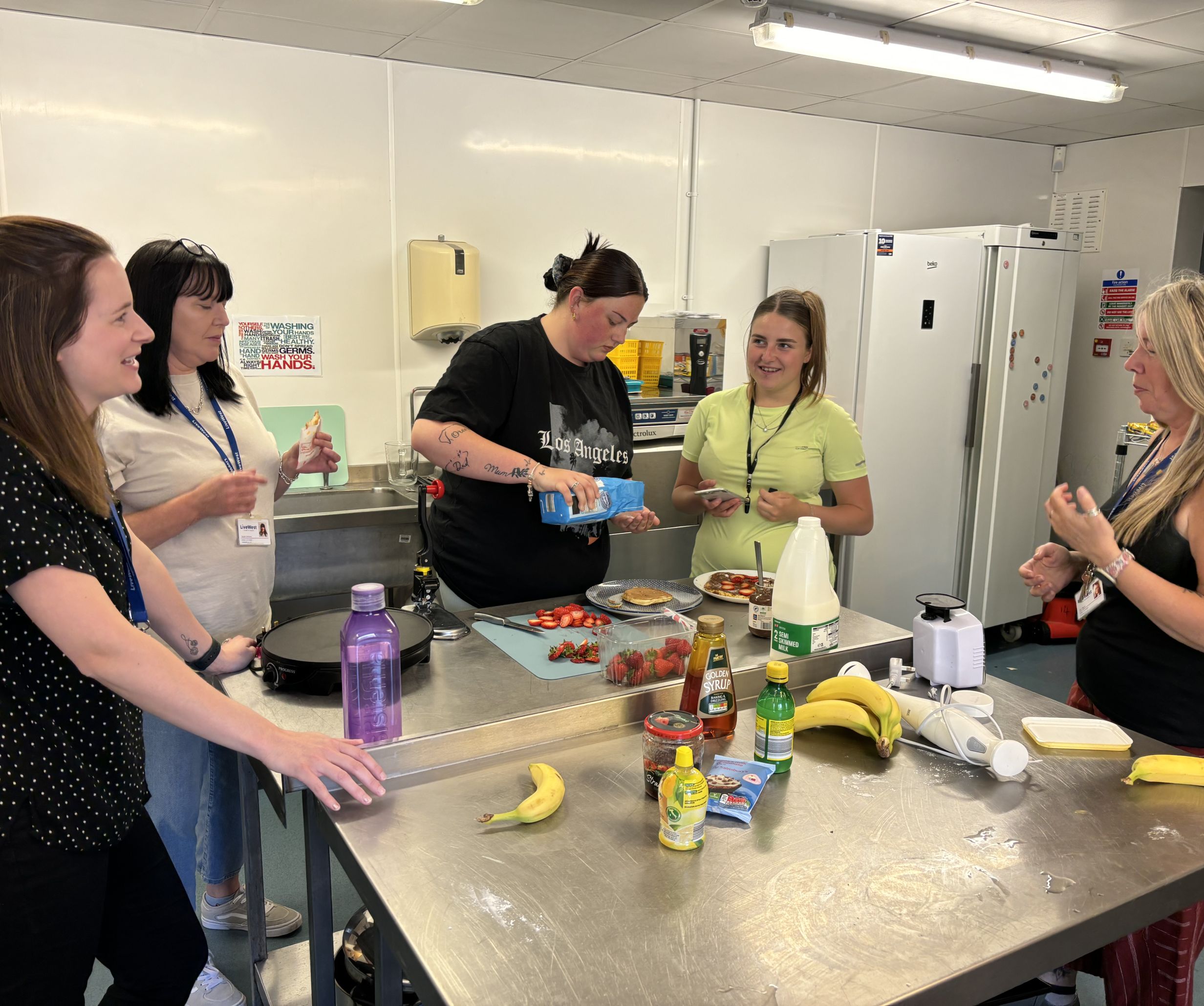 Plymouth Foyer kitchen with people in