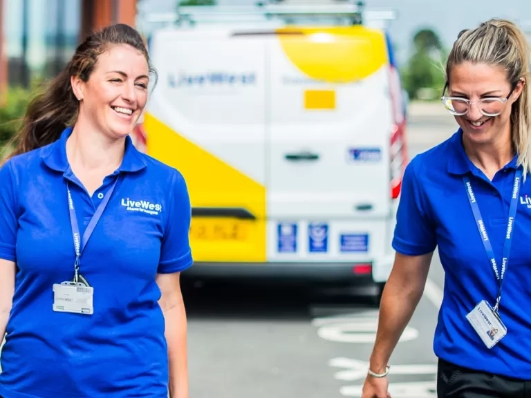 two tradeswomen walking