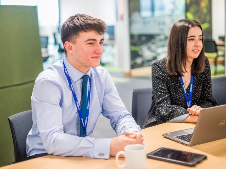 Two apprentices smiling 