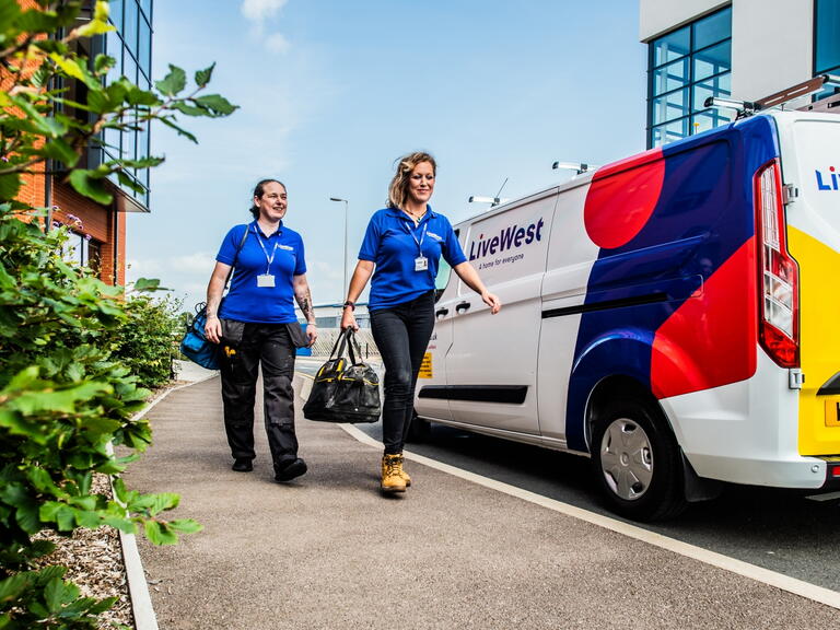LiveWest colleagues by a LiveWest van. 