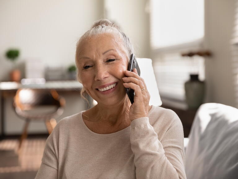 Lady speaking on the phone. 