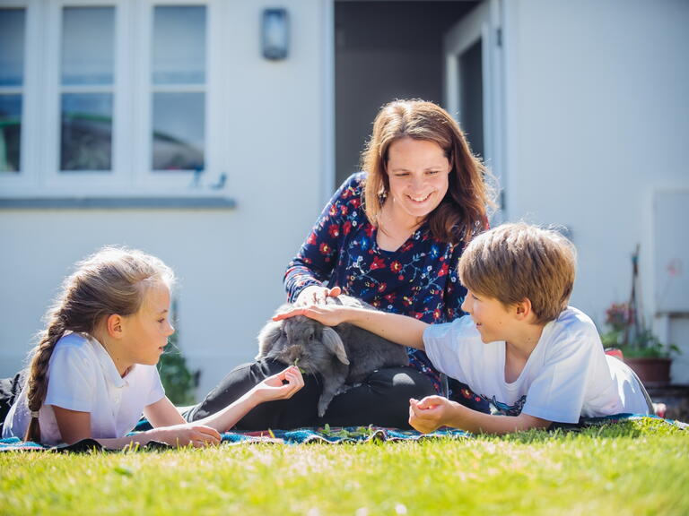 A woman with two children. 