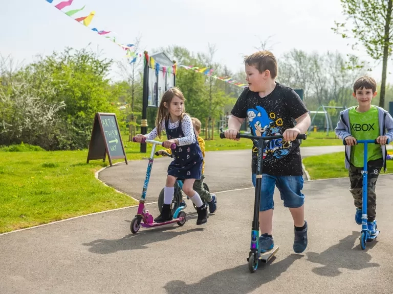 children on scooters