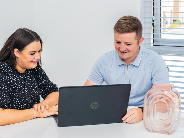 Customers using a laptop