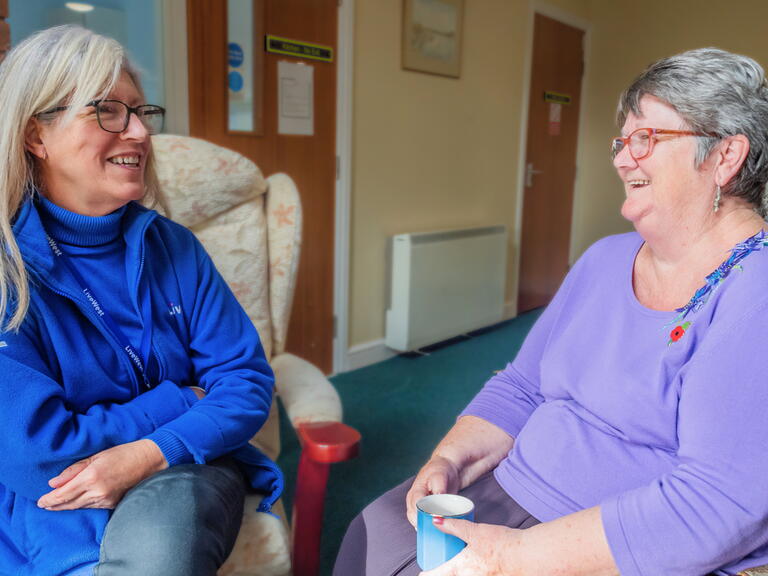 LiveWest colleague talking to one of our residents, Jenny, about her new windows.