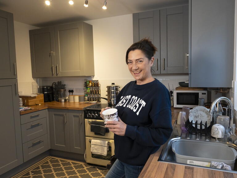 Mary in her kitchen in the new build home in Congresbury.