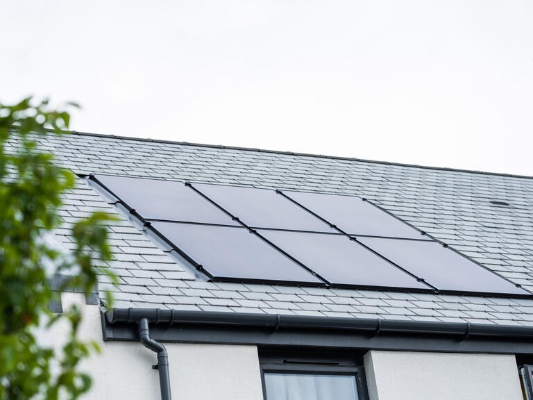 Image of solar panels on the roof of a house. 