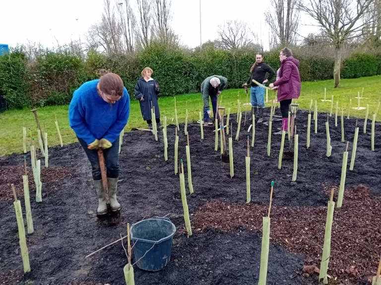 Volunteers at the Waters Edge. Image by Exmouth Tiny Forest Group.