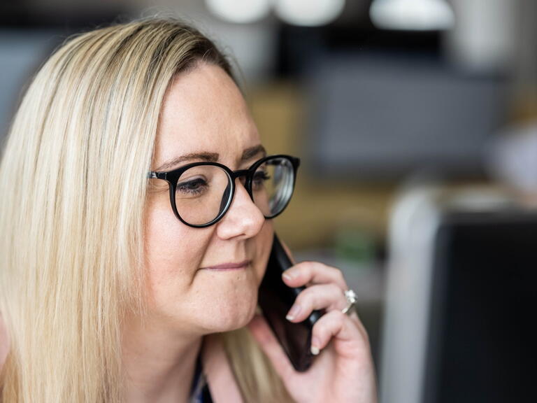LiveWest colleague speaking on a mobile phone. 