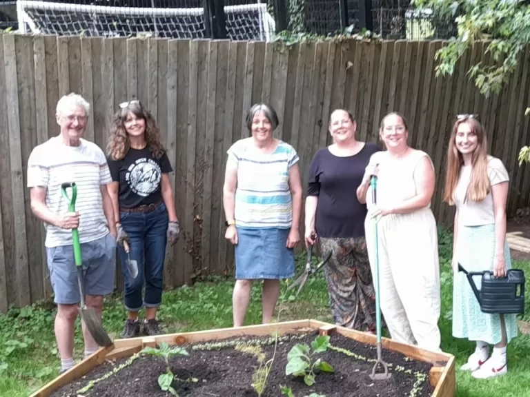 A group of volunteers in the new community garden.