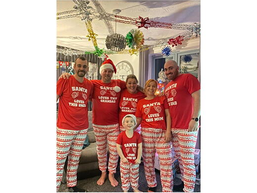 Jayne and her family in matching Christmas pyjamas. 