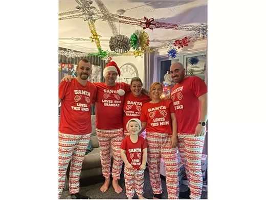 Jayne and her family in matching Christmas pyjamas. 