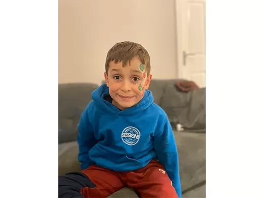 Zachary sat on a sofa who is a winner our competition. 