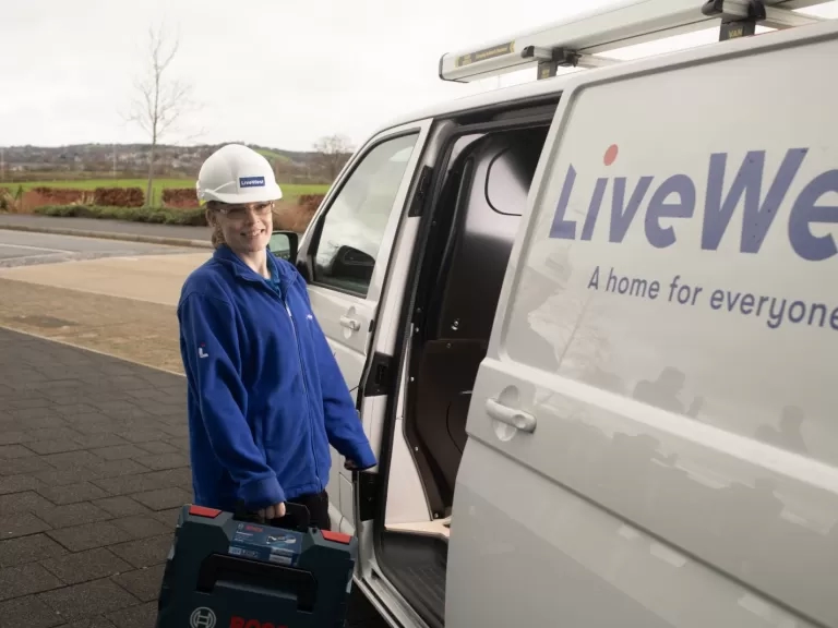 Charlie Hardy taking a tool box out of a LiveWest van.
