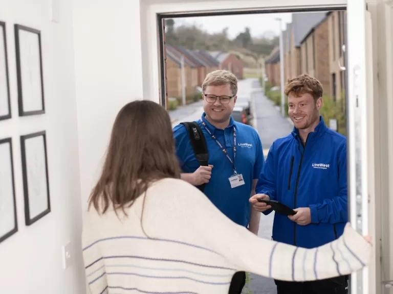 George and Craig chatting to a resident at her front door.