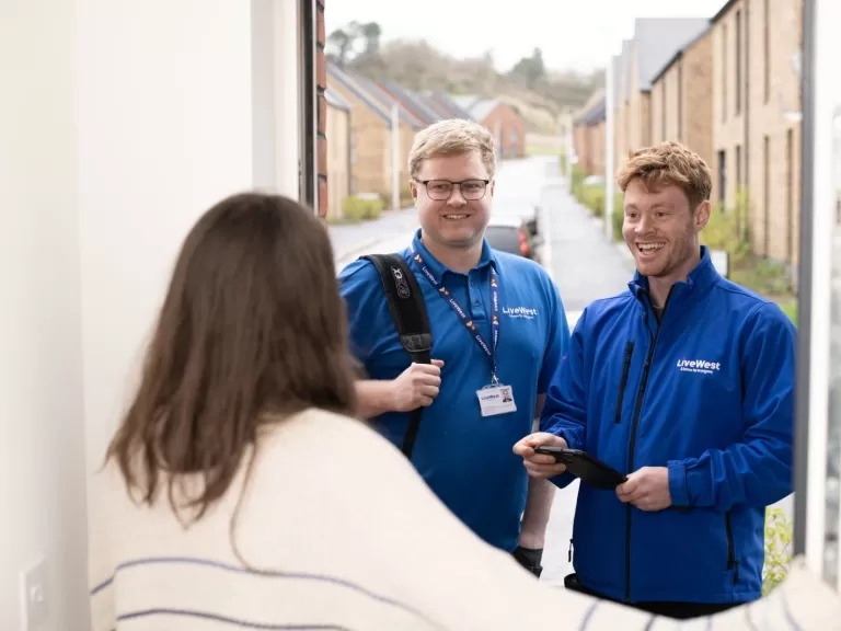 Trades colleagues at a customer's door