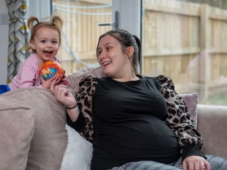 Shannon and Ava inside their new home
