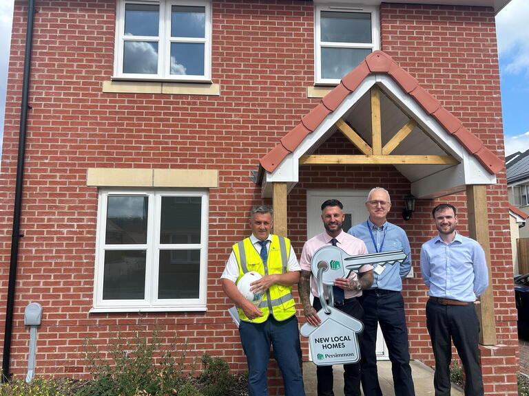Representatives from LiveWest and Persimmon Homes marking the handover of 35 affordable homes at Haywood Village in Weston-super-Mare.