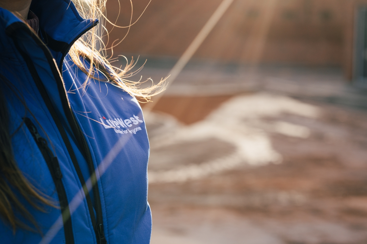 LiveWest logo on a blue coat. 