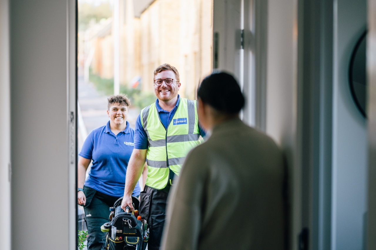 LiveWest colleagues at the door of a customers' home.