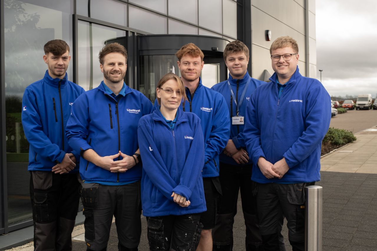 Image of LiveWest apprentices outside a building.