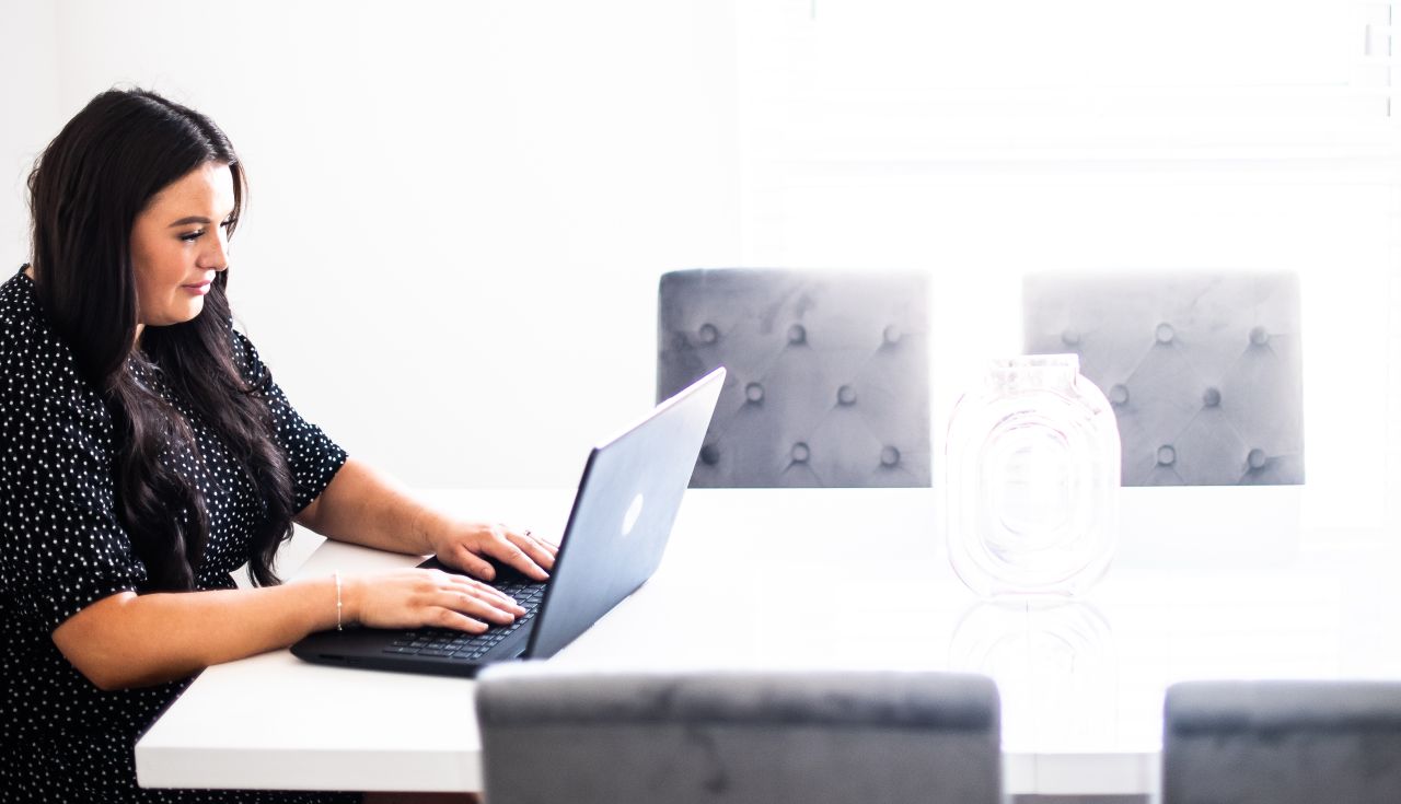 Image of a woman using a laptop.