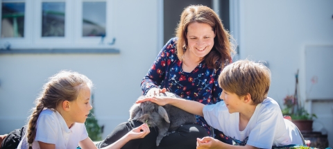 A woman with two children.