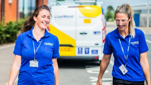 two tradeswomen walking