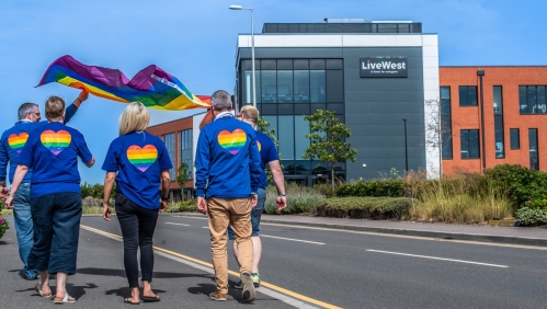 LiveWest colleagues with a Pride flag at our Exeter office