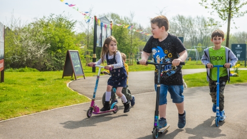 children on scooters