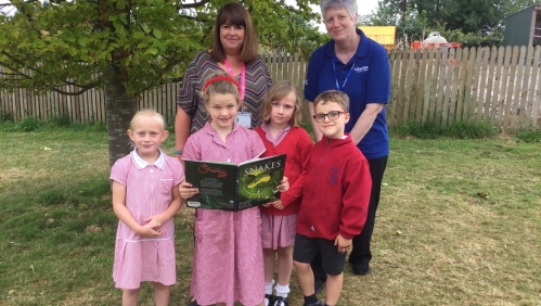 LiveWest colleague with children from school where book tokens were donated. 