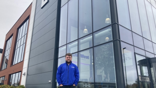 Ben Logan smiling outside of our Exeter office.